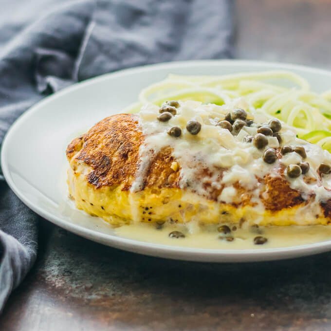 These healthy chicken breasts are pan-seared and then roasted until tender and juicy. They pair fantastically well with a creamy lemon caper sauce.