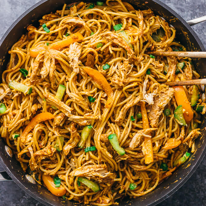 overhead view of peanut noodles with shredded chicken