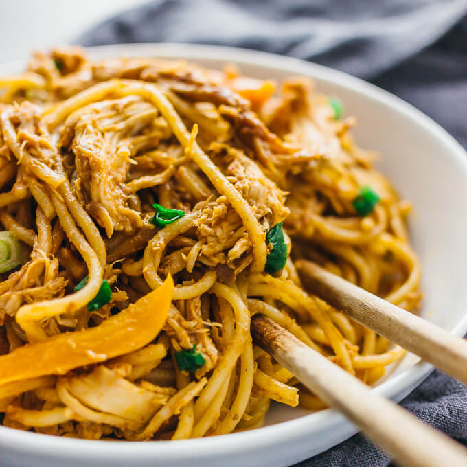 close up view of peanut noodles and shredded chicken