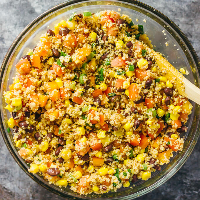 stirring ingredients for couscous salad