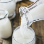 pouring horchata into a glass