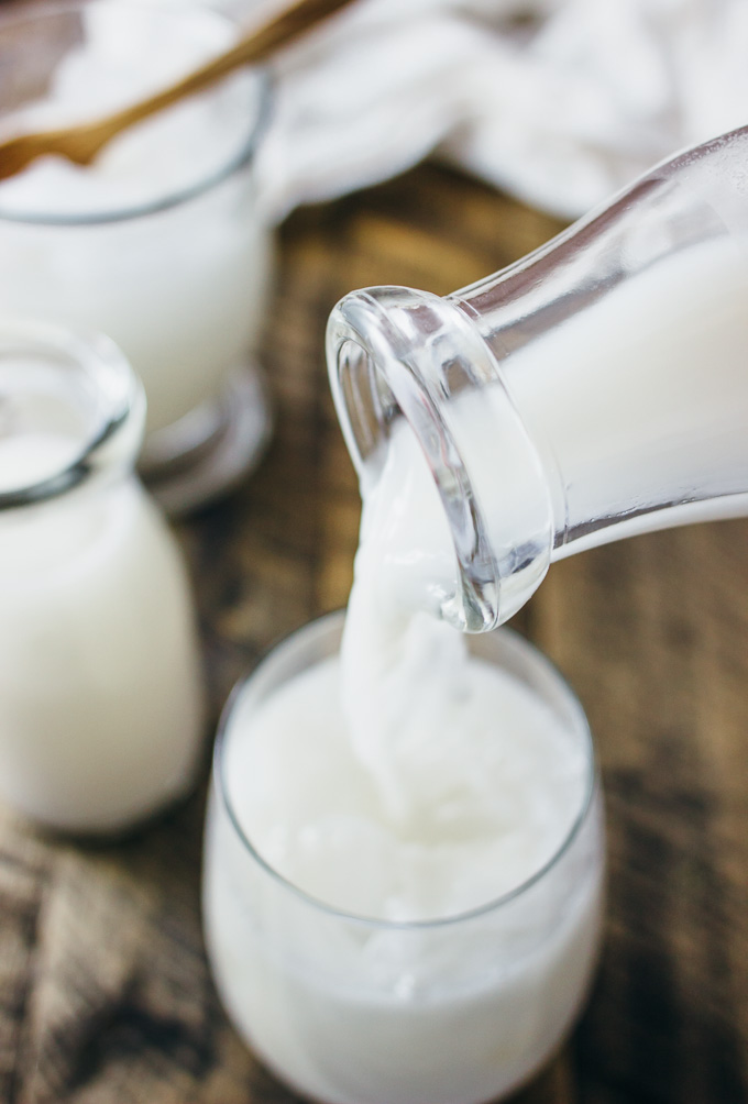 pouring horchata into a glass