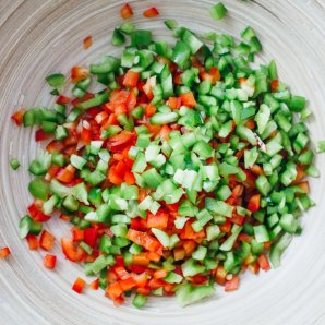 Easy pasta salad ingredients including red and green bell peppers
