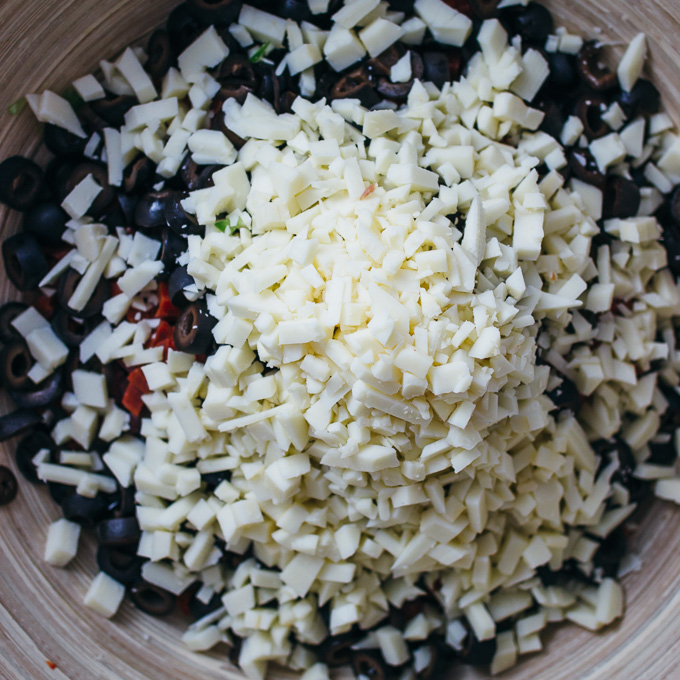 asiago cheese and olives in salad bowl