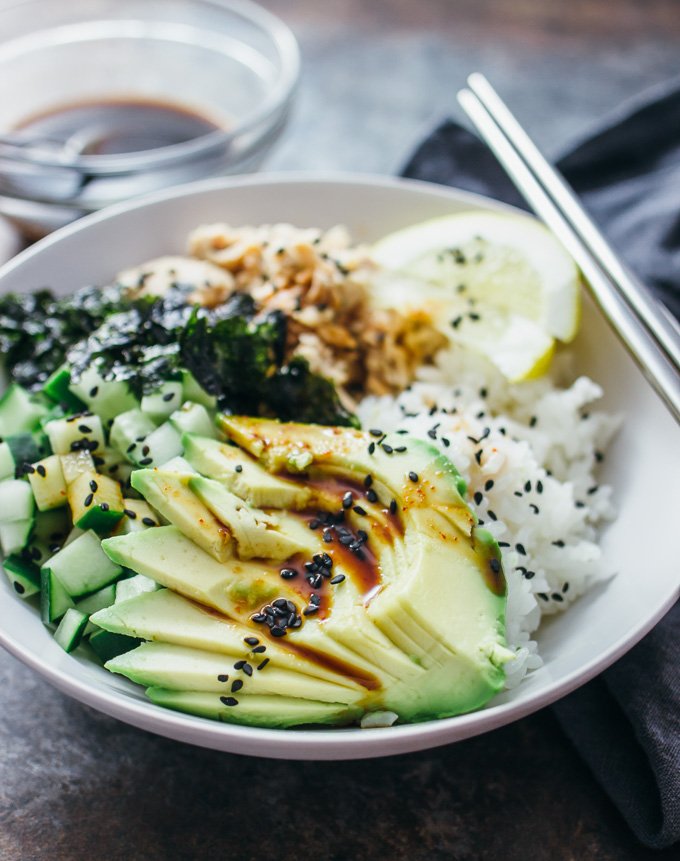 salmon roll sushi bowl served with chopsticks