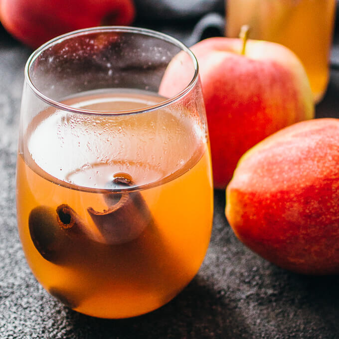 a glass of cranberry apple cider