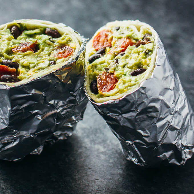 Guacamole burrito with balsamic roasted tomatoes and black beans