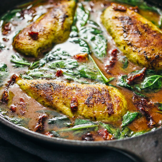 Pan seared chicken with spinach in a coconut milk curry