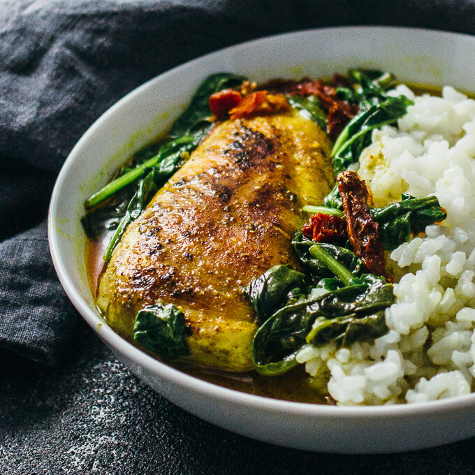 Chicken with coconut milk curry served with rice in a bowl
