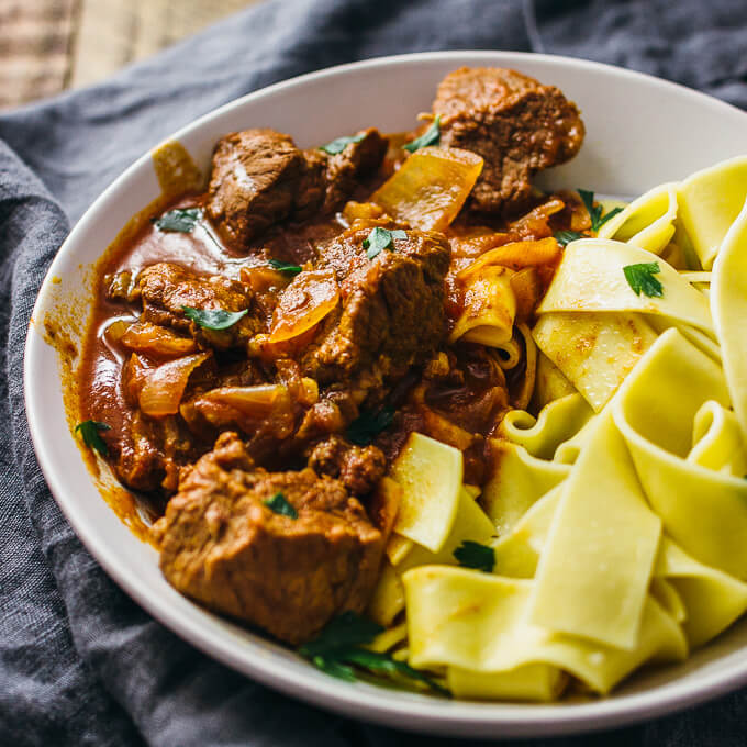 hungarian beef goulash served in a white bowl