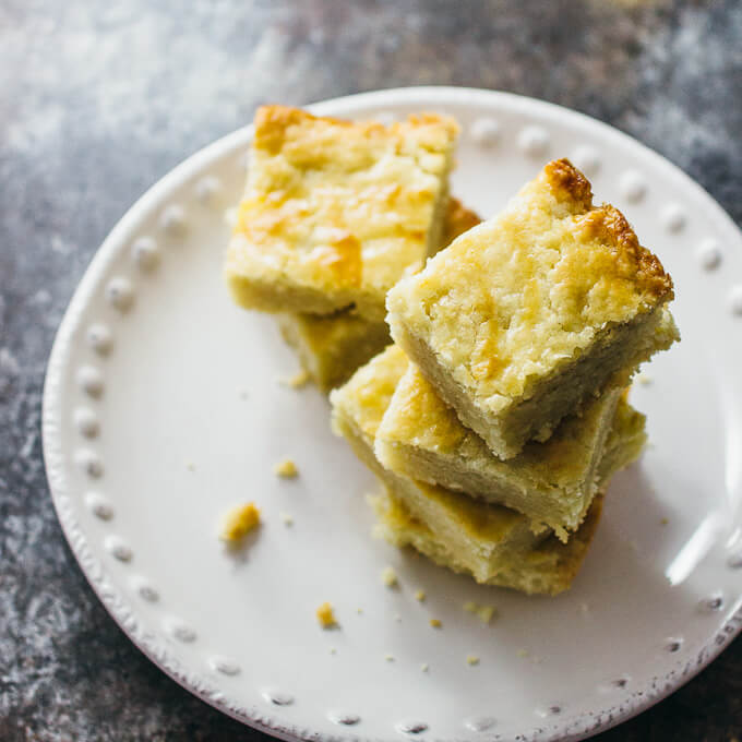 a stack of shortbread butter bars on a plate