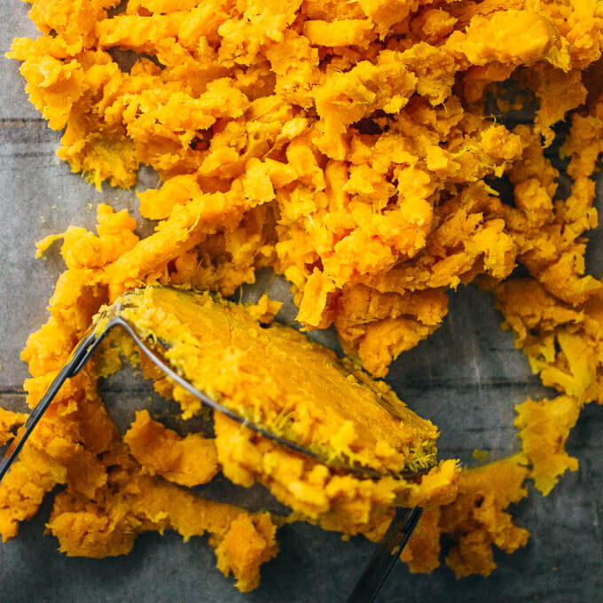 mashing sweet potatoes