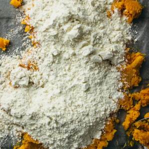 Dusting flour over mashed sweet potatoes
