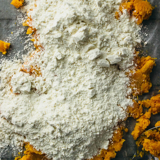 mixing sweet potatoes with flour