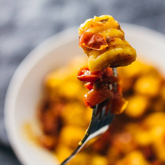 holding up sweet potato gnocchi on a fork