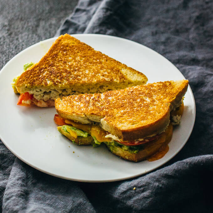 tuna melts with avocado on white plate