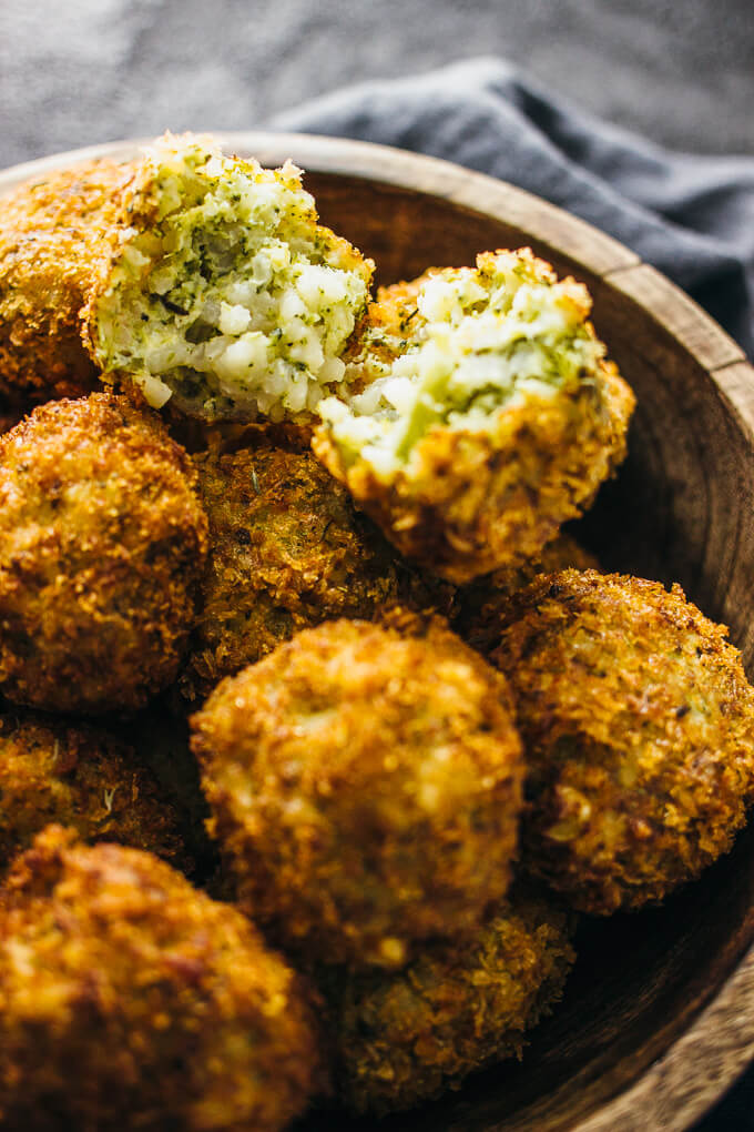 close up of arancini in wooden bowl