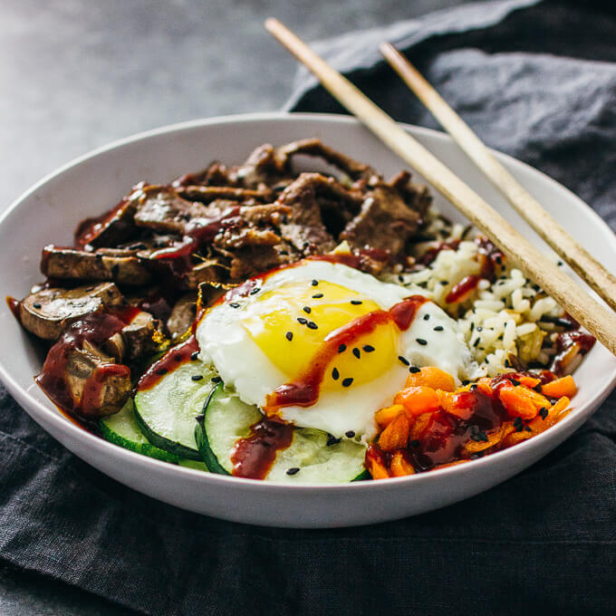 bibimbap served in white bowl