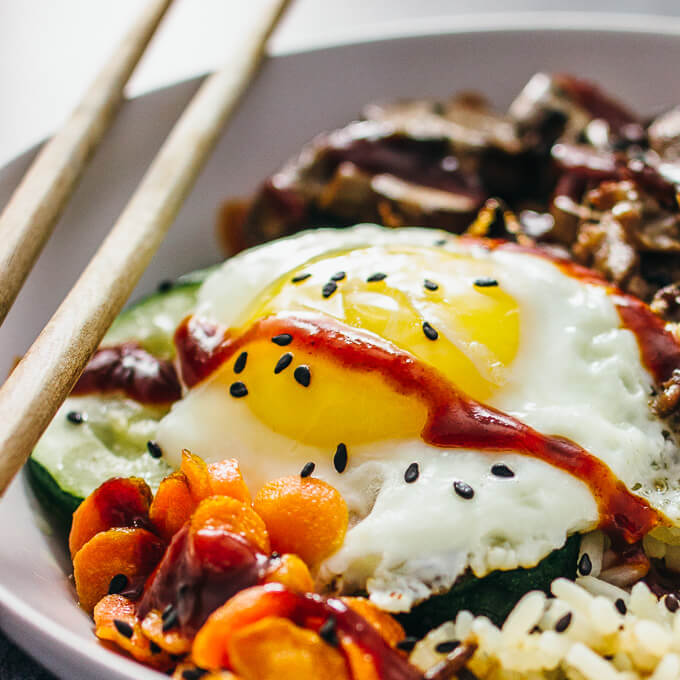 close up view of egg in bibimbap bowl