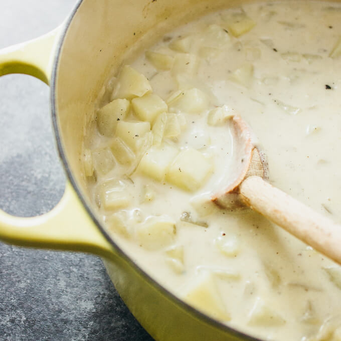 making potato soup in yellow dutch oven