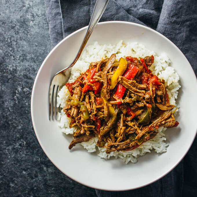 overhead view of ropa vieja served in a white bowl