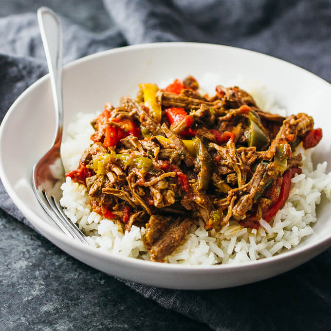 ropa vieja served on steamed white rice