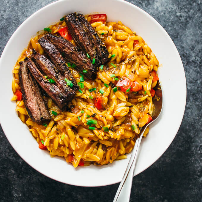 overhead view of skirt steak orzo pasta dish