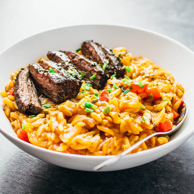 skirt steak orzo pasta served in white bowl