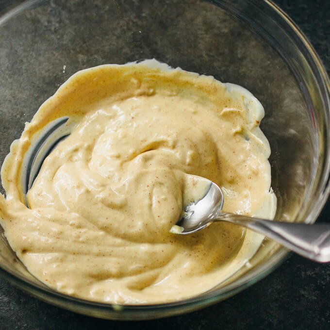 stirring garlic mustard dip