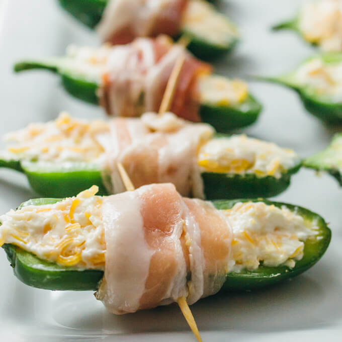 wrapping stuffed jalapenos with bacon