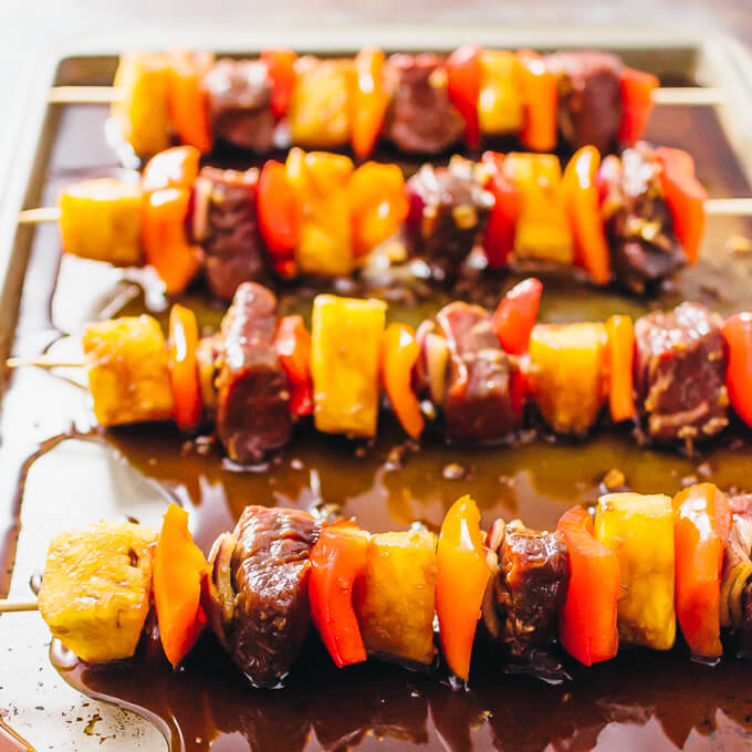 cooking steak kabobs on baking tray