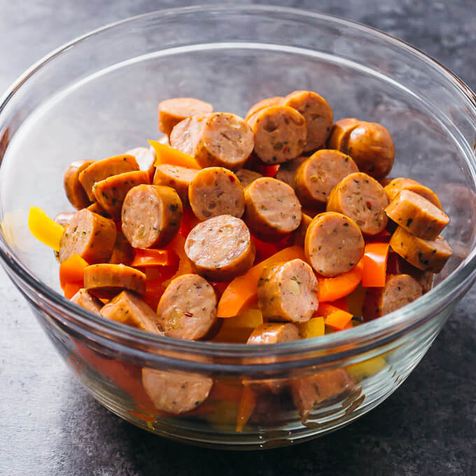 sliced sausage and bell peppers in bowl