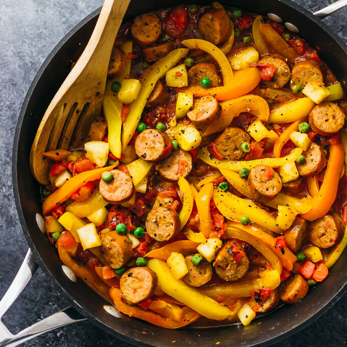 cooking hawaiian sausage and bell peppers in pan