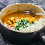 chicken tikka masala served with rice and cilantro