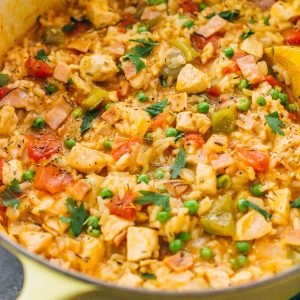 cooking chicken and rice dinner in dutch oven