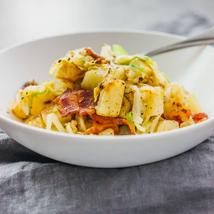 Fried cabbage and potatoes with bacon savory tooth