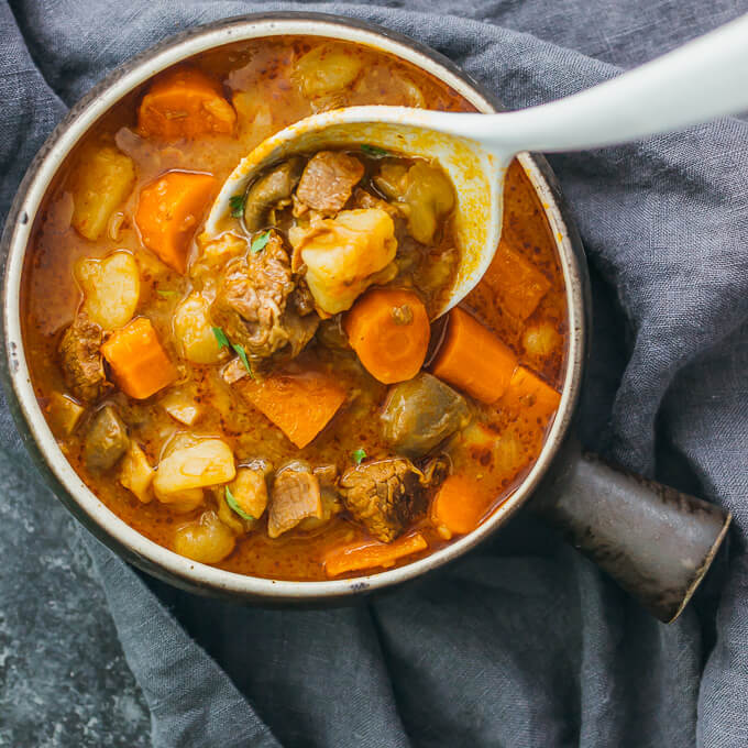 overhead view of beef stew with potatoes and carrots