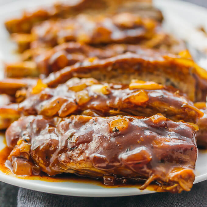 Pork ribs with barbecue sauce and onions are one of the most delicious and simple dishes you can make in the Instant Pot or slow cooker.