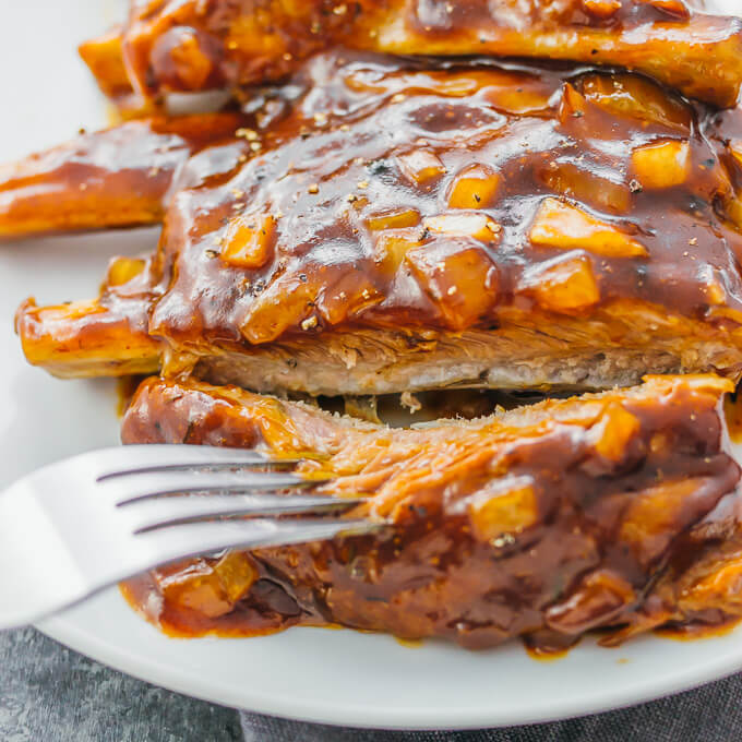 Pork ribs with barbecue sauce and onions are one of the most delicious and simple dishes you can make in the Instant Pot or slow cooker.