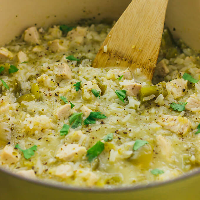 salsa verde chicken and rice cooking in pot