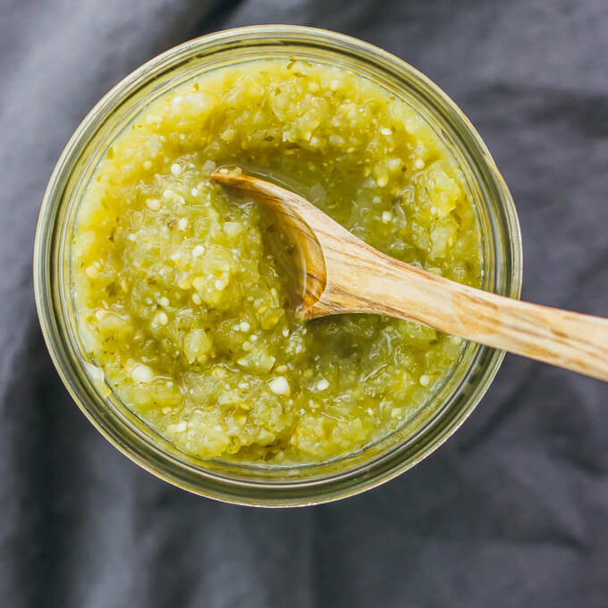 overhead view of salsa verde with wooden spoon