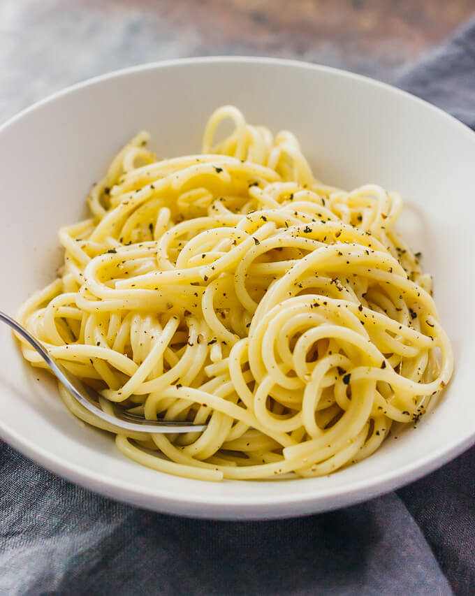 Cacio e pepe is one of the simplest pasta dishes -- spaghetti with melted parmesan cheese and black pepper.