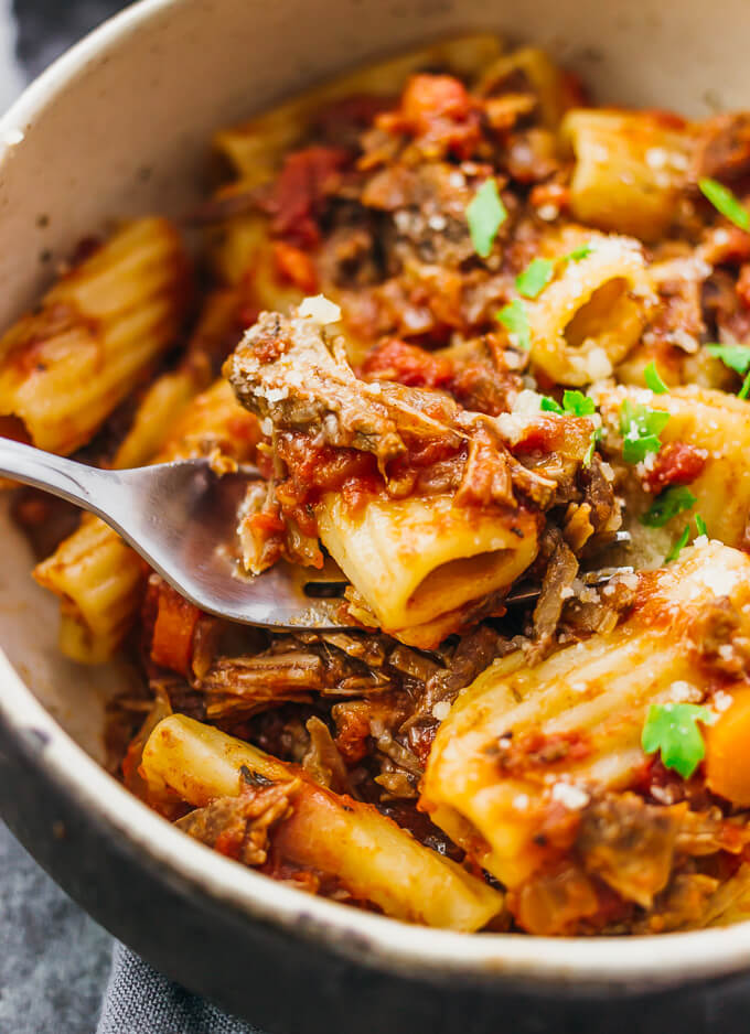 Here's a recipe that really makes the slow cooker shine: deliciously tender shredded beef ragu sauce paired with rigatoni pasta.