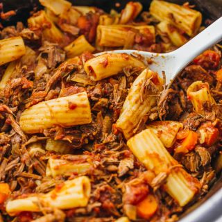 Here's a recipe that really makes the slow cooker shine: deliciously tender shredded beef ragu sauce paired with rigatoni pasta.