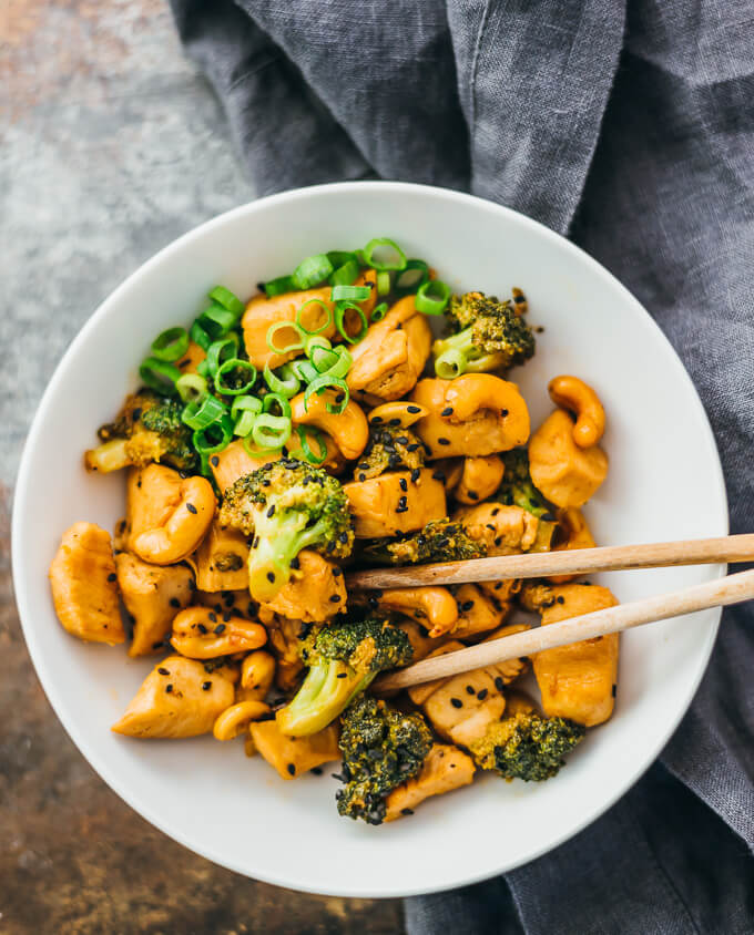 cashew chicken stir fry served in white bowl