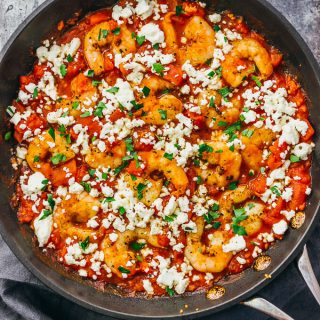overhead view of shrimp with tomatoes and feta cheese