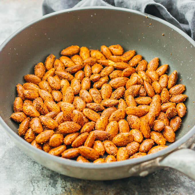 These savory spiced almonds have a spicy smoky garlic flavor, and are easily cooked in just 5 minutes on a pan. It's an easy vegan recipe that makes for a healthy and flavorful snack.