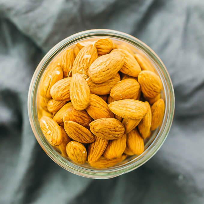 These savory spiced almonds have a spicy smoky garlic flavor, and are easily cooked in just 5 minutes on a pan. It's an easy vegan recipe that makes for a healthy and flavorful snack.