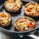 These easy and low carb portobello mushrooms are stuffed with cheddar cheese, onions, and crispy bacon.