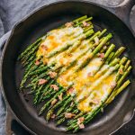 This baked asparagus is an easy side dish with melted cheese and bacon.